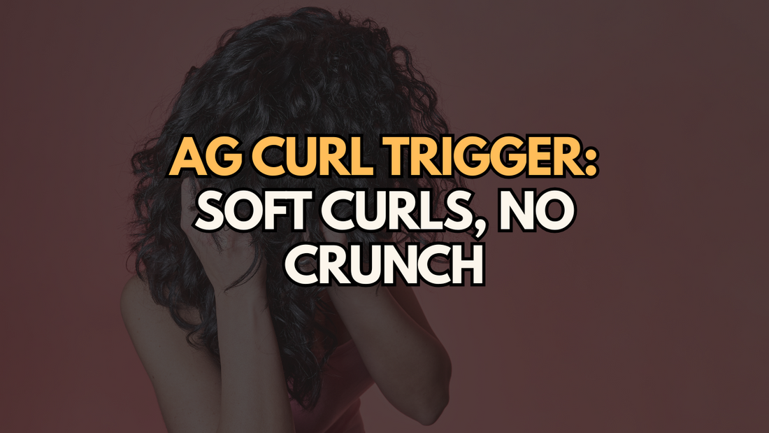 Curly-haired woman with her hands near her face on a soft red background, overlaid text reading “AG Curl Trigger: Soft Curls, No Crunch.”